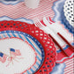 Patriotic 4th of July cocktail napkin with red, white, and blue stars and stripes from Gatherings by Curated Paperie.