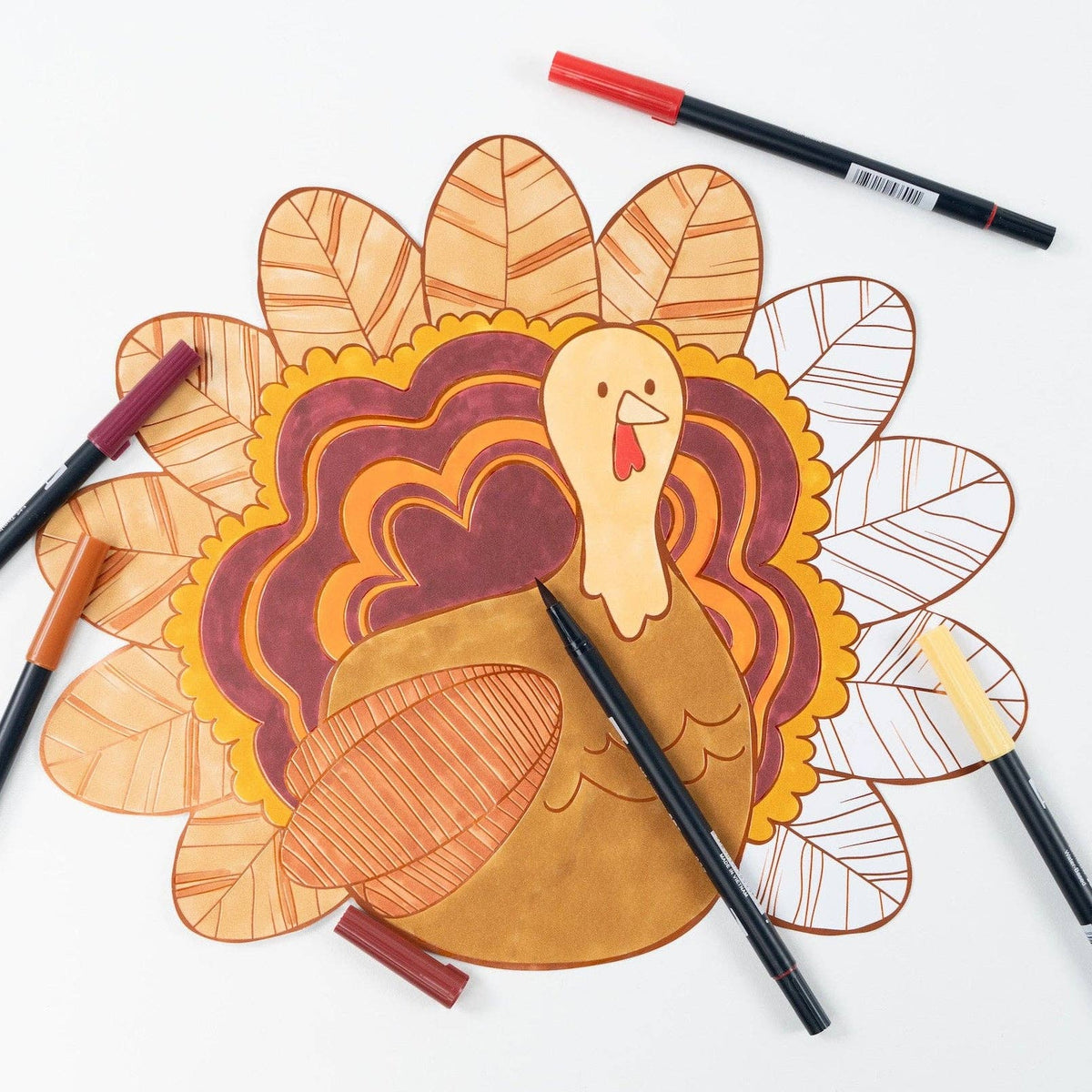 Thanksgiving turkey coloring placemats by Gatherings by Curated Paperie with festive turkey illustrations for kids' holiday activities.