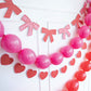 My Mind’s Eye bow and heart banner set with colorful paper banners and festive decorations for celebrations.