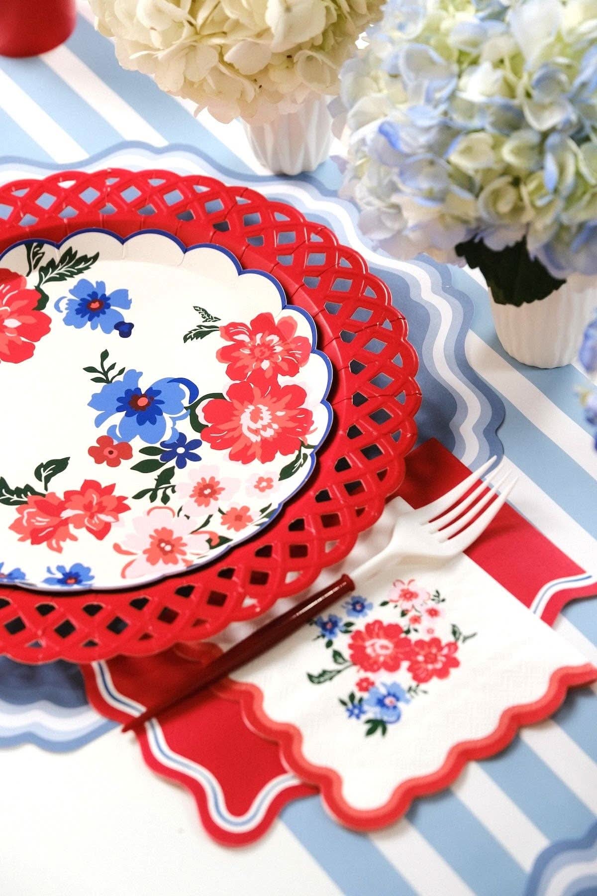 Red Basketweave Dinner Paper Plates from Gatherings by Curated Paperie, featuring a woven basket pattern on sturdy paper plates.