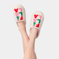 Shiraleah FA LA LA slippers in large/X-large size featuring festive red and green patterns on soft fabric soles.