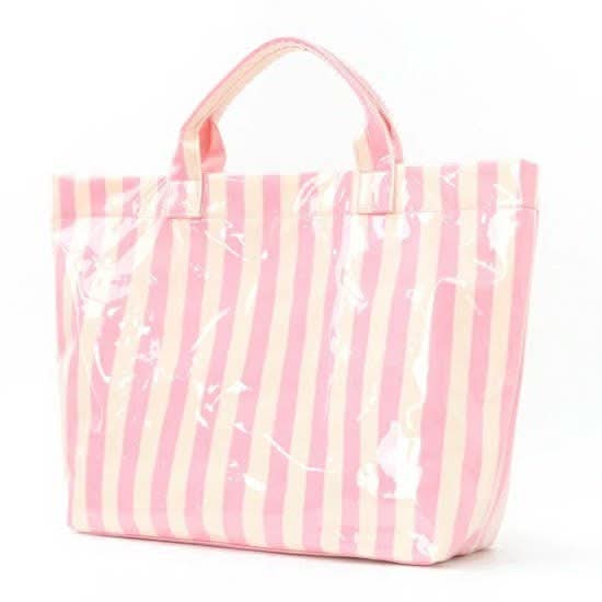 Large pink and yellow striped vinyl tote bag by JOSSLYN featuring bold color blocks and sturdy handles.