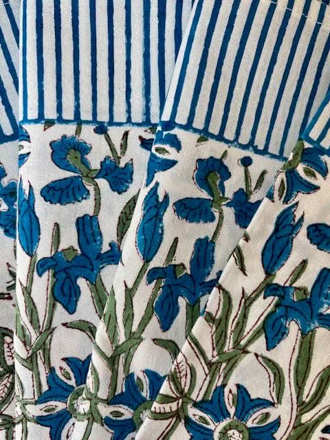 Set of 4 blue Pinwheel Napkins by Christina Dickson Home featuring a vibrant bluebird design for decorative table settings.
