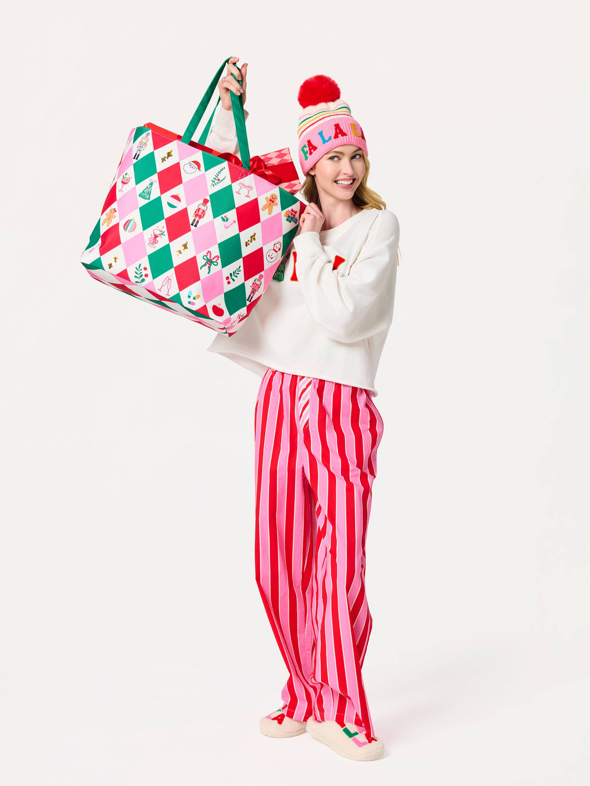 Shiraleah FA LA LA slippers in S/M, cozy holiday-themed slippers with red and white patterns, soft fabric soles.