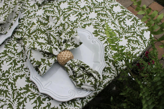 Set of four pressed floral napkins in olive green by Christina Dickson Home, showcasing elegant botanical design.
