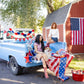 My Mind's Eye America Felt Pennant Banner with red, white, and blue felt flags strung together for patriotic decoration.