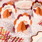 Set of 12 Turkey Time Place Cards by xo, Fetti featuring festive Thanksgiving-themed paper place cards with turkey illustrations.