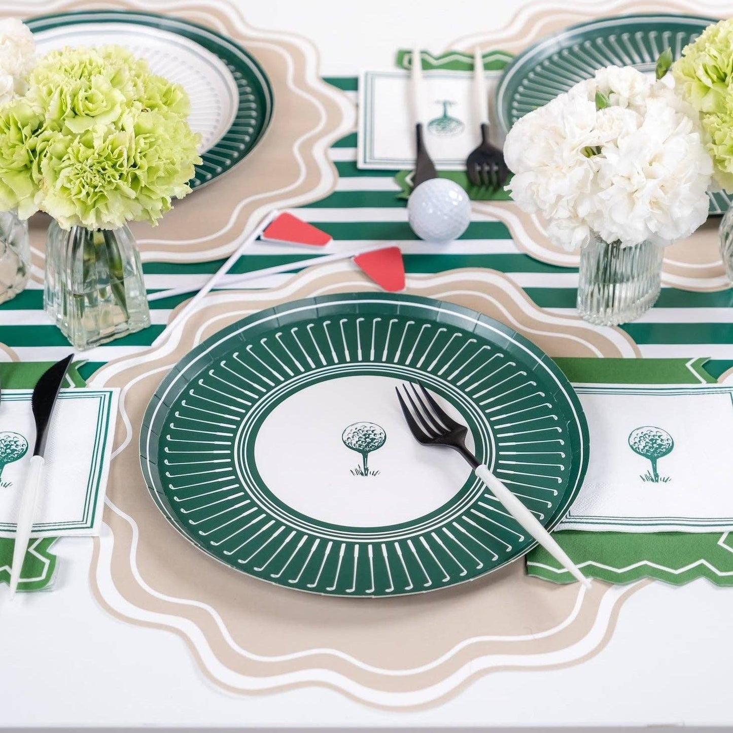 Set of 8 Gatherings by Curated Paperie 10.5-inch golf-themed dinner plates arranged on a table setting.