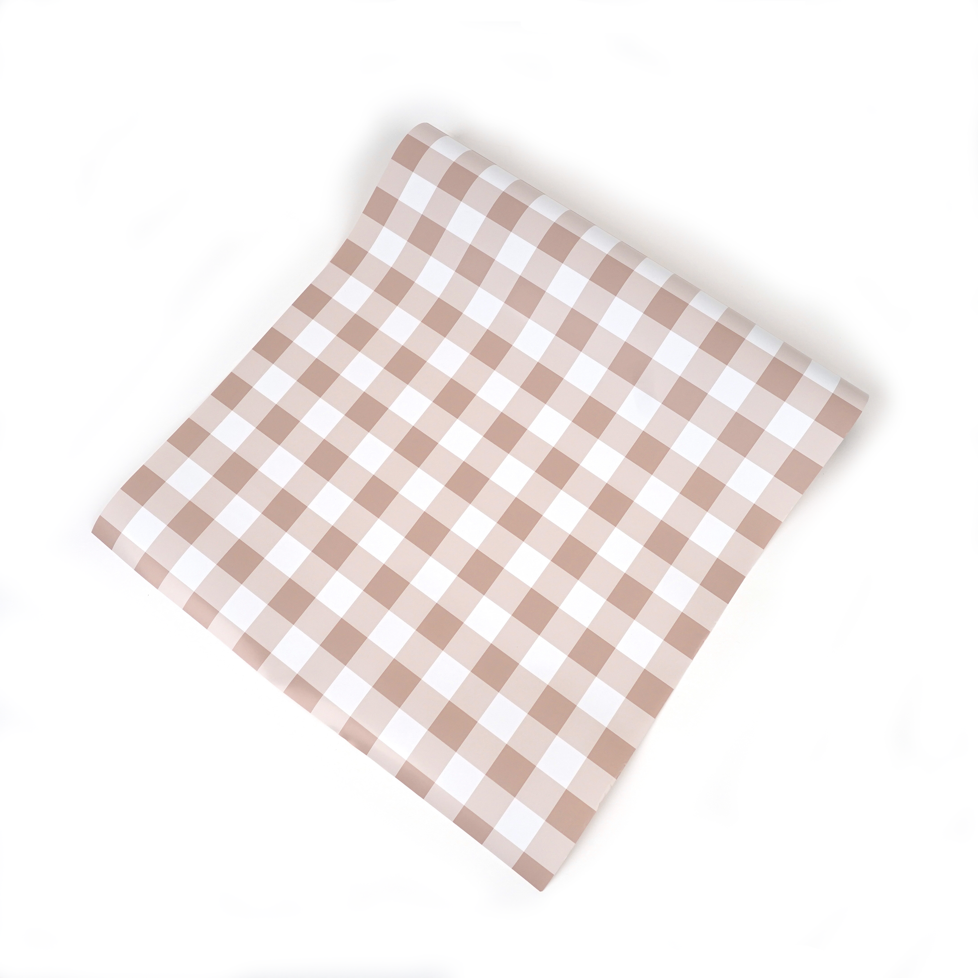Brown gingham paper table runner with a classic checkered pattern, ideal for festive table settings and gatherings.