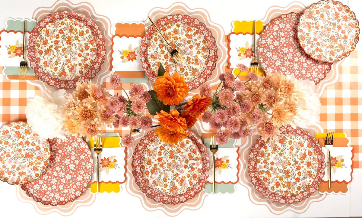 Autumn floral dessert plates by Gatherings by Curated Paperie with orange, yellow, and brown fall floral patterns on round plates
