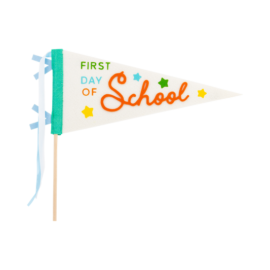 First Day Felt Pennant by My Mind’s Eye featuring colorful embroidered lettering on a felt pennant for school celebrations.
