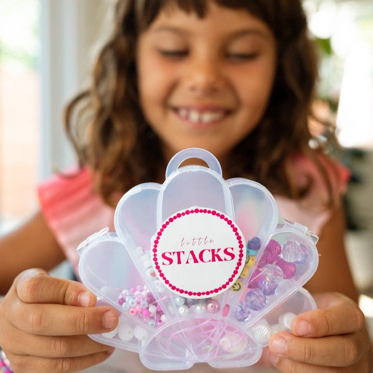 Colorful Shell Kit by Little Stacks featuring various shell-shaped building blocks and accessories for creative play.