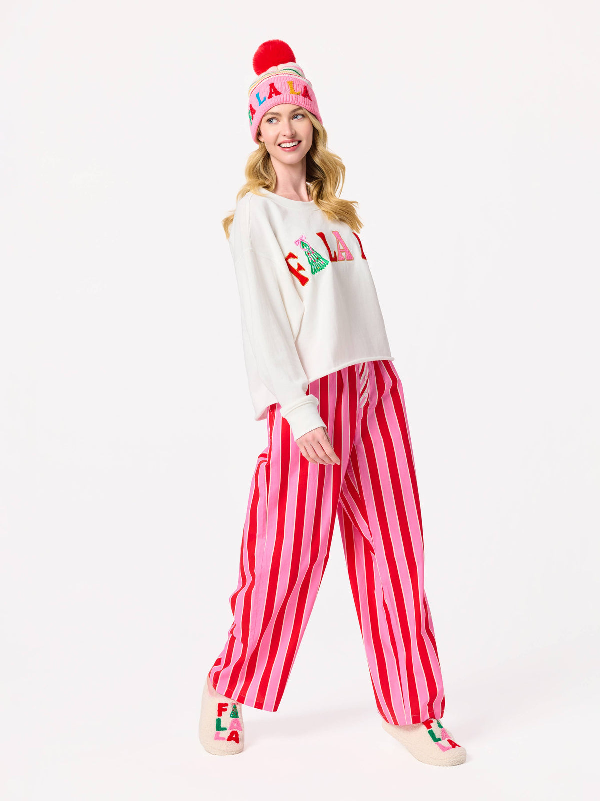 Shiraleah FA LA LA slippers in large/extra-large size with cozy red and white holiday-themed design, plush fabric for comfort