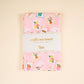 Waffle tea towel with "It's Mahj Time" text from The Darling Effect, featuring a soft, textured fabric in a cozy kitchen setting.