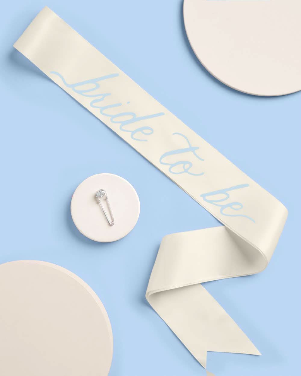 Bride To Be sash from xo, Fetti featuring white fabric and bold "Bride To Be" text for wedding celebrations.