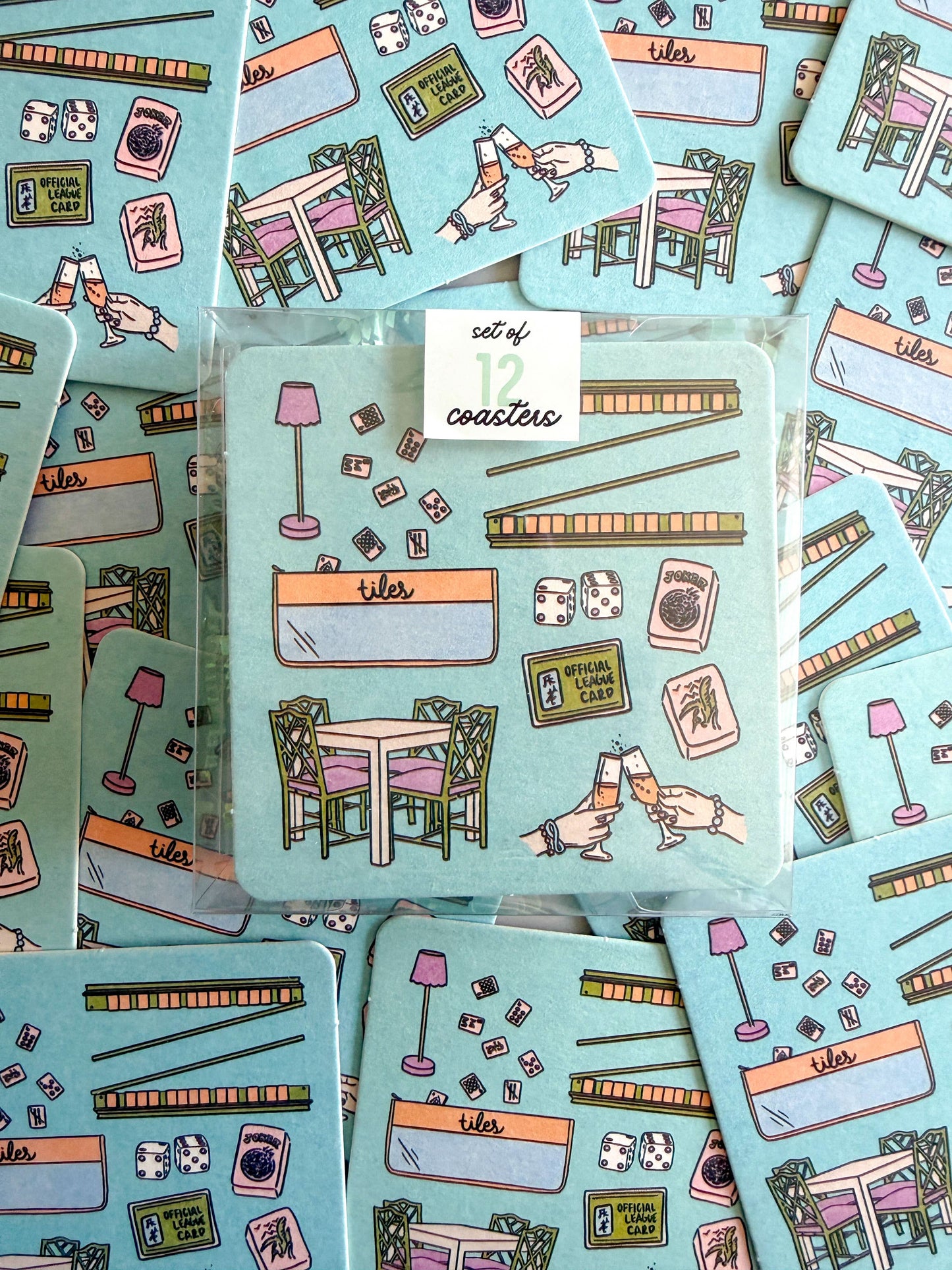 Set of 12 Mahjong Essentials disposable coasters by Thirteenwinks, featuring traditional Mahjong tile designs.