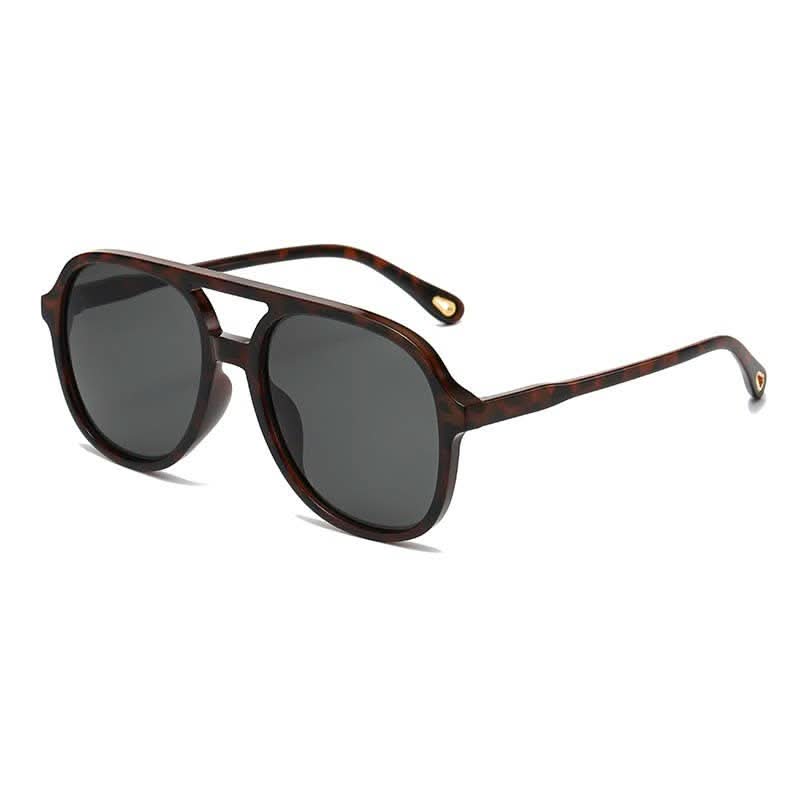 Set of 12 JOSSLYN oversized frame sunglasses featuring classic design and black plastic frames, perfect for stylish sun protection.