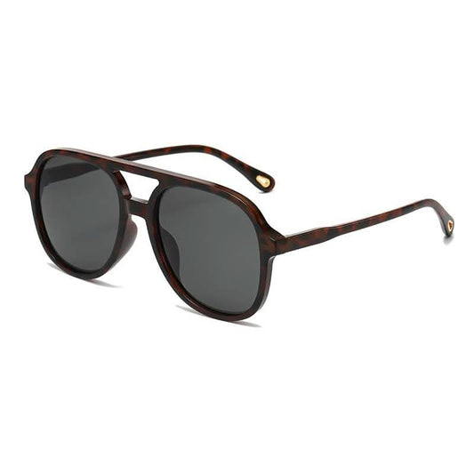 Set of 12 JOSSLYN oversized frame sunglasses featuring classic design and black plastic frames, perfect for stylish sun protection.