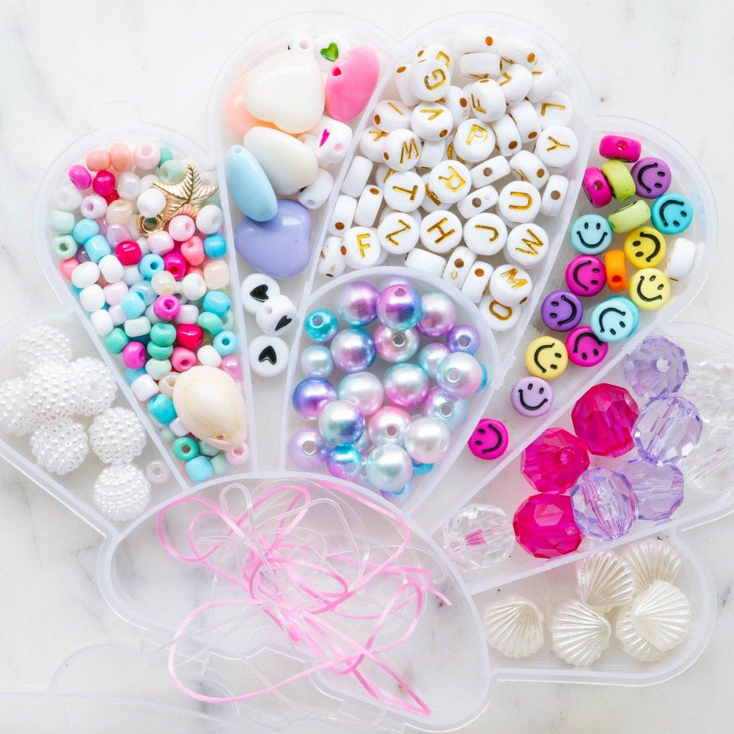 Colorful shell-shaped stacking kit by Little Stacks featuring seven vibrant, interlocking plastic shells for kids' creative play.