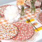 Gatherings by Curated Paperie autumn floral dinner plates with colorful fall leaf and flower patterns on white ceramic.