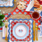 My Mind’s Eye plaid stars paper cocktail napkin with a colorful star and plaid pattern, designed for festive occasions.