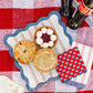 Red striped paper plate from My Mind’s Eye, 11-inch size, featuring a vibrant red and white striped design for celebrations.