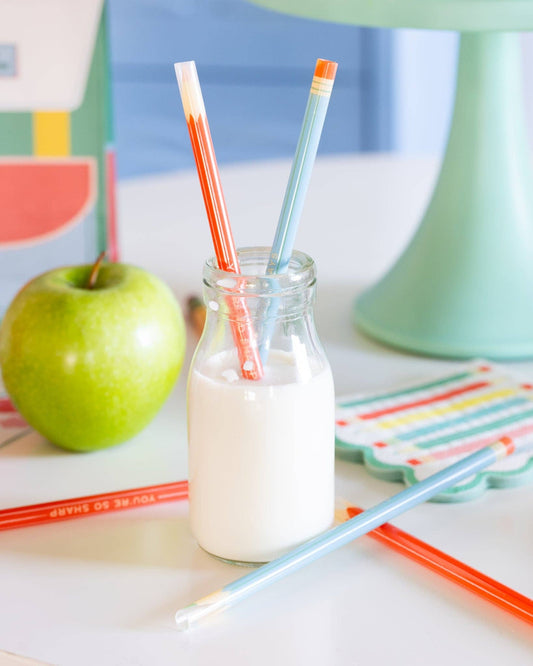 Set of 12 colorful reusable plastic straws from My Mind’s Eye, designed like colored pencils for eco-friendly drinking.