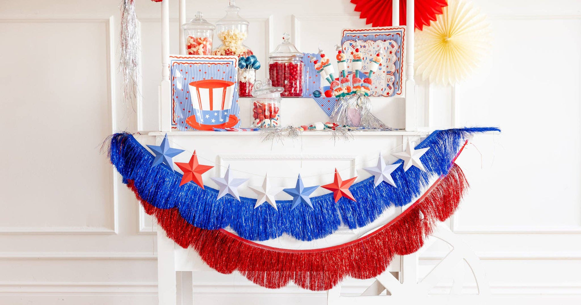 Fringed scallop banner set by My Mind’s Eye with colorful scalloped fabric flags for party decorations.