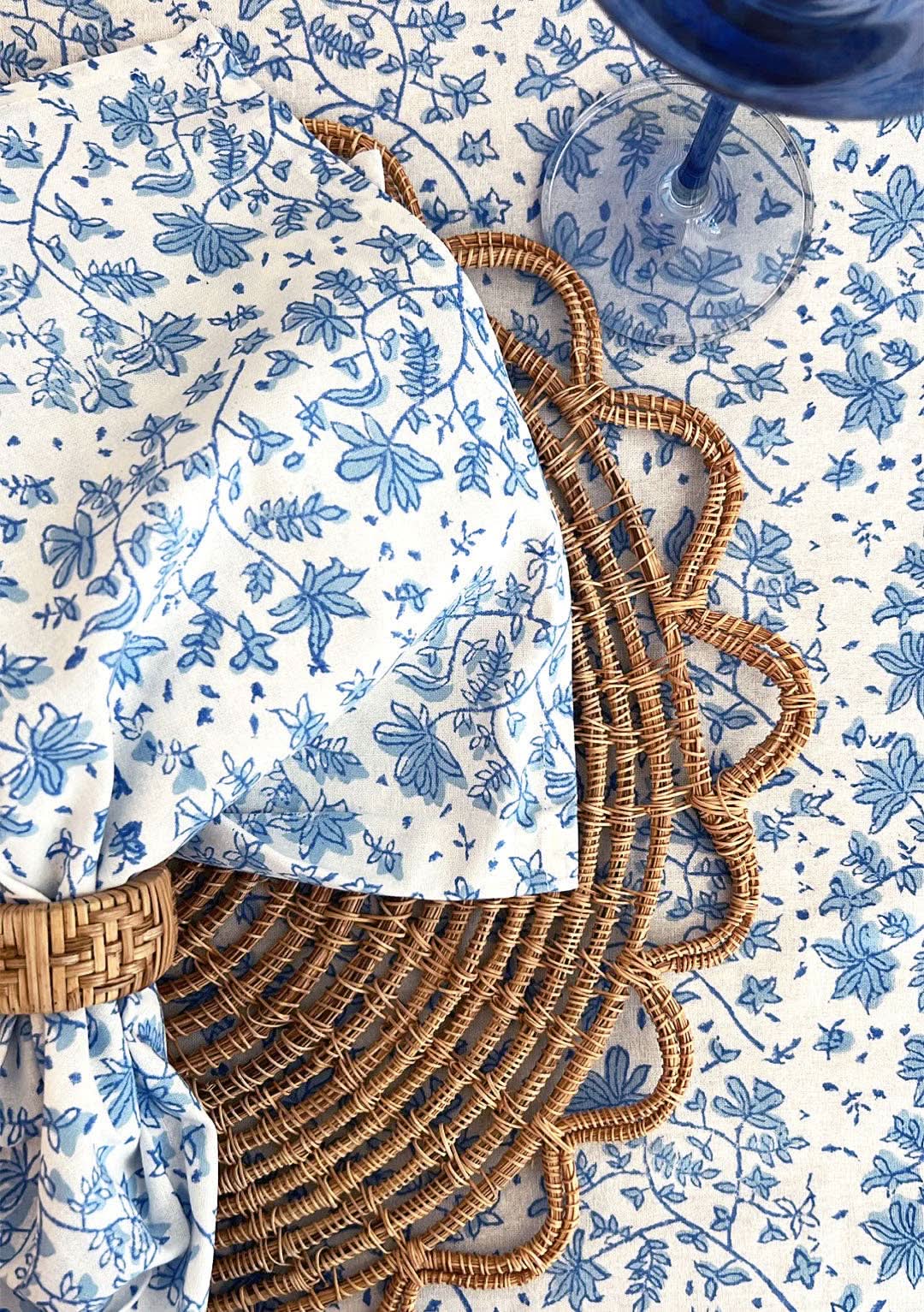Set of four Whimsy Floral Napkins in Sorrento Blue by Christina Dickson Home, featuring elegant floral patterns on soft fabric.