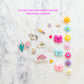 Little Stacks The Shell Kit featuring colorful, stackable shell-shaped toys arranged in a playful display.