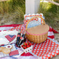 My Mind’s Eye floral table runner with vibrant, colorful flower patterns on a fabric surface.
