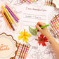 Give Thanks paper tablecloth by xo, Fetti with autumnal leaf and pumpkin designs for Thanksgiving table decor.