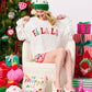 Shiraleah FA LA LA slippers in size large/extra large, cozy fabric with festive holiday design and soft soles.