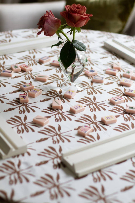 Walnut brown Dragonfly Lures tablecloth by Christina Dickson Home, featuring a detailed dragonfly pattern on smooth fabric.