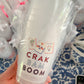 Six frosted paper cups with colorful Crak Bam Boom designs by Porcupine Paper Co. arranged in a pack on a white background.