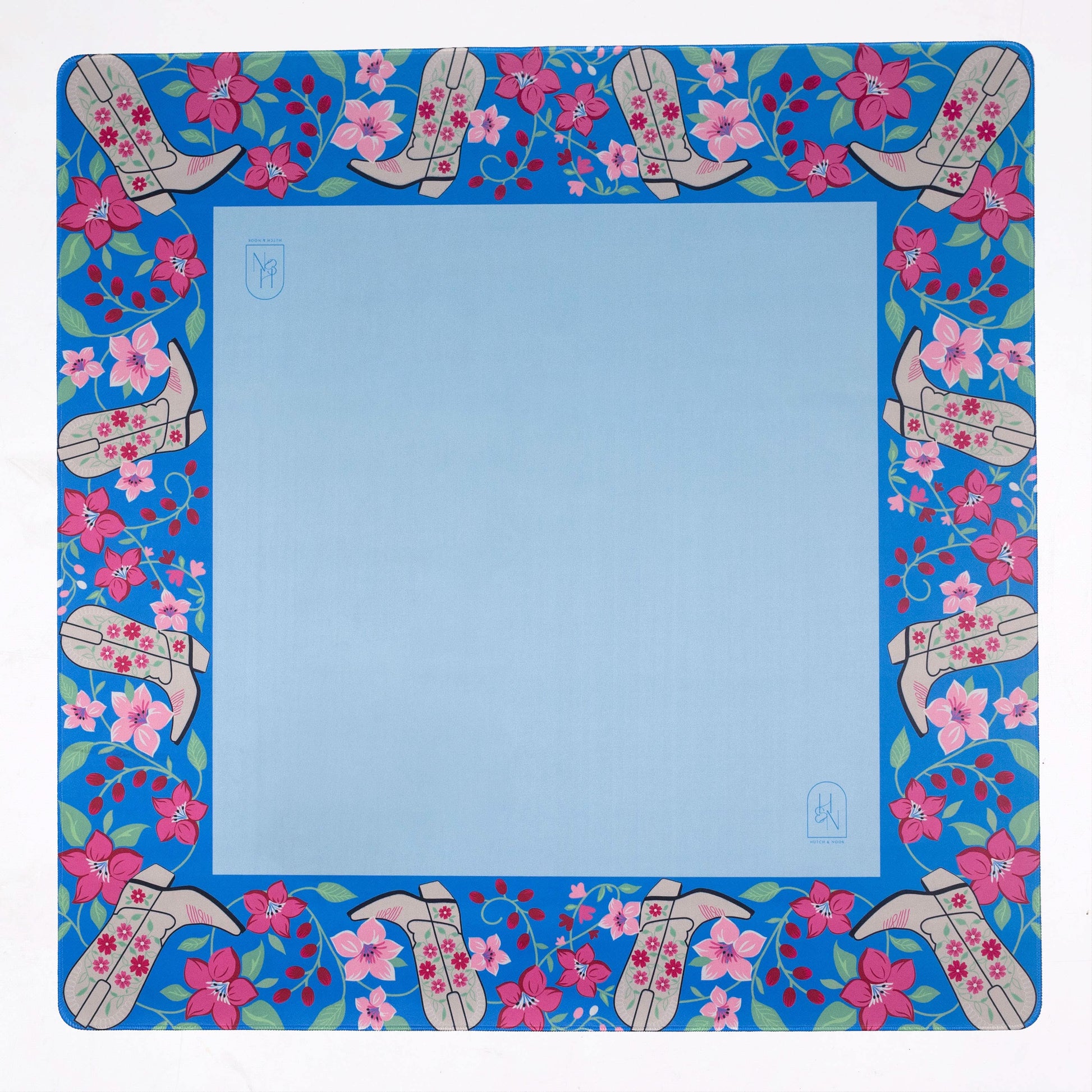 Blue cowboy boot-shaped mat from Hutch and Nook, featuring detailed western-style stitching and vibrant blue color.