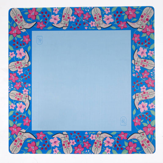 Blue cowboy boot-shaped mat from Hutch and Nook, featuring detailed western-style stitching and vibrant blue color.