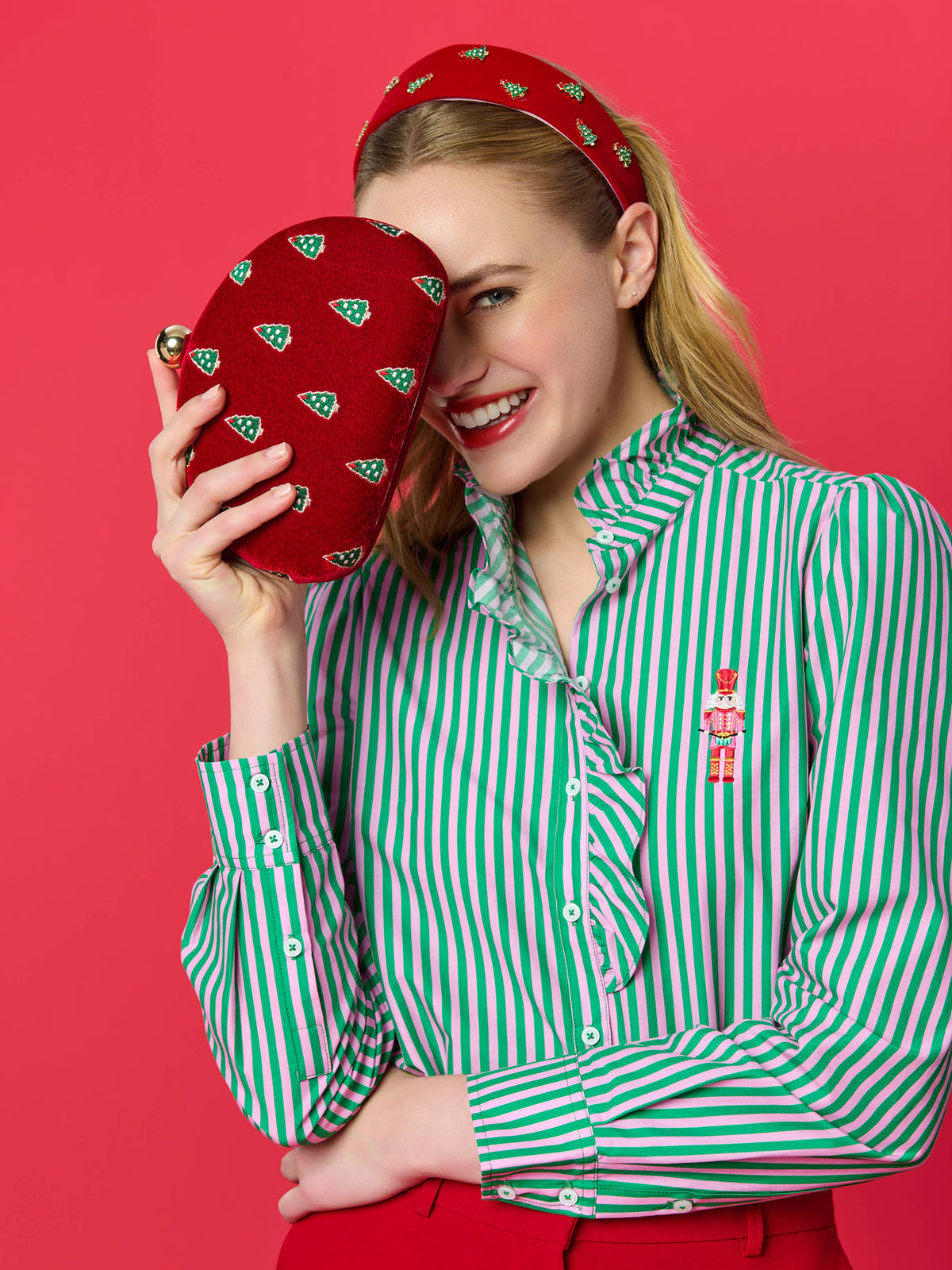 Shiraleah Trees Minaudière in crimson with a textured floral design, featuring a metallic clasp and compact, elegant shape.