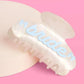 Pearl acrylic bride clip by xo, Fetti featuring a blue and white pearl design, perfect for wedding hairstyles.
