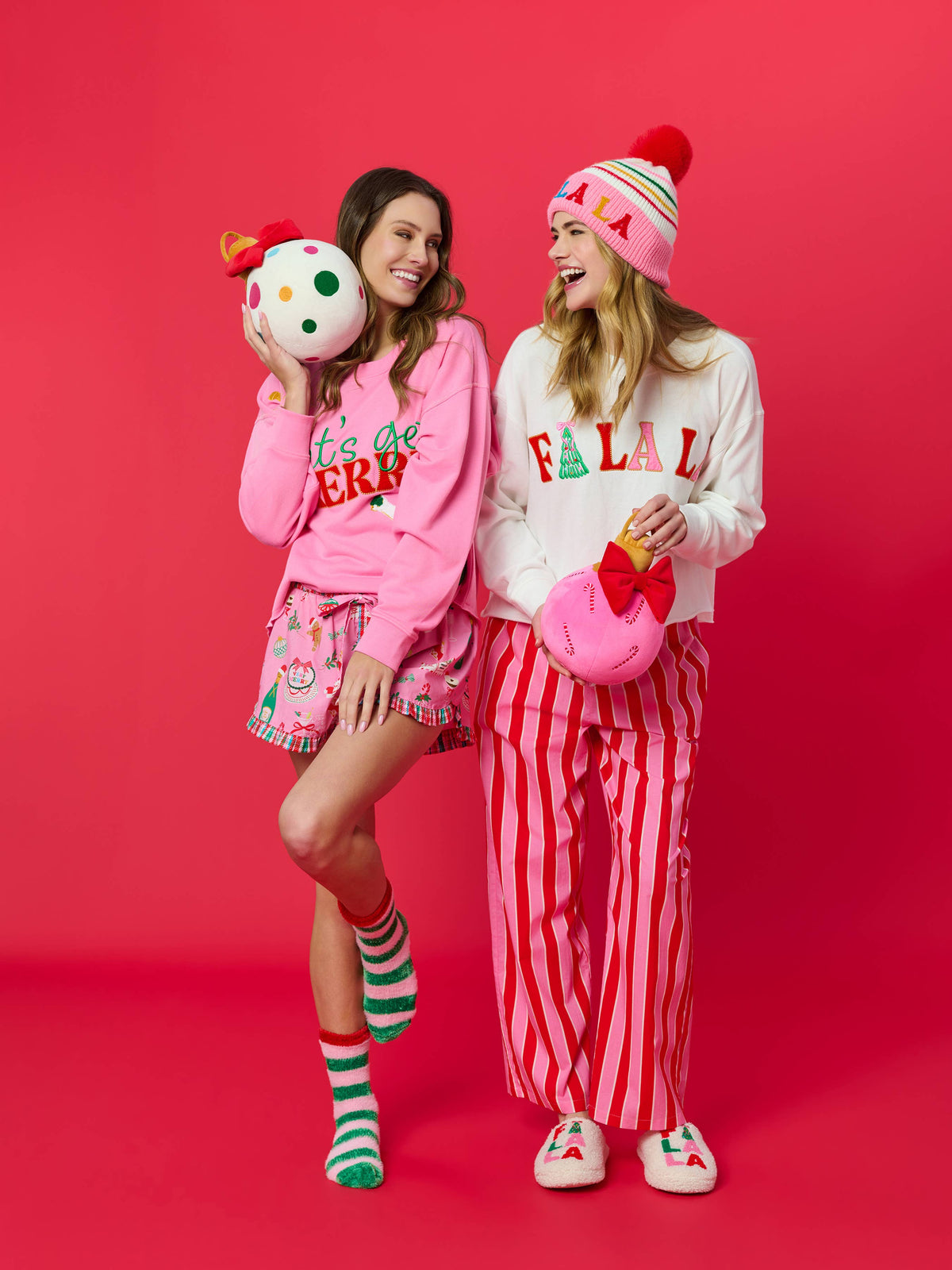 Shiraleah FA LA LA slippers in large/extra-large size featuring festive red and green Christmas patterns and cozy fabric.