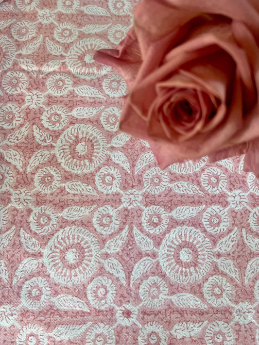 Round 120-inch Feathered Tile Tablecloth in Dusty Rose by Christina Dickson Home, showcasing intricate feathered tile pattern.