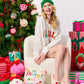 Shiraleah FA LA LA slippers in S/M size with festive red and white design, cozy plush interior, ideal for holiday comfort