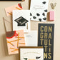Flying Hats Graduation Greeting Card by Ginger P. Designs featuring colorful, illustrated graduation caps and celebratory design.