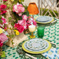 Emerald green Poms tablecloth by Christina Dickson Home, 120x70 inches rectangle, with colorful pom-pom design on fabric