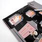 Haunted house-shaped Halloween paper plates with spooky black and orange design from Gatherings by Curated Paperie