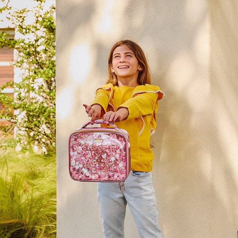 Pink Bows and Confetti Lunchbox by Packed Party, featuring a colorful design with bows and confetti patterns on a pink background.