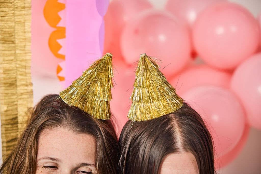 Set of four Golden Girl mini gold fringe party hats with shiny metallic finish, perfect for celebrations and festive events.
