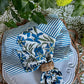 Set of four Bluebird Pinwheel Napkins by Christina Dickson Home, featuring colorful, patterned paper napkins with pinwheel design.