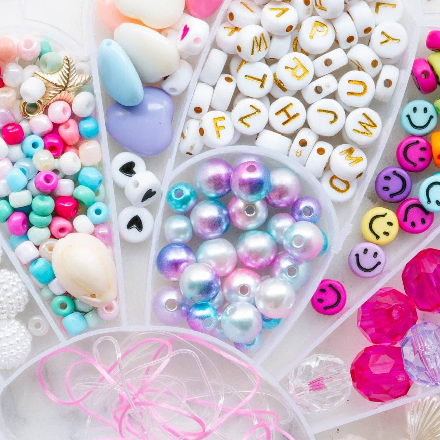 Little Stacks The Shell Kit with colorful wooden shells and storage box, ideal for sensory and educational play.