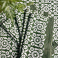 Set of four Feathered Tile Napkins by Christina Dickson Home featuring elegant feathered tile pattern in soft, neutral tones.